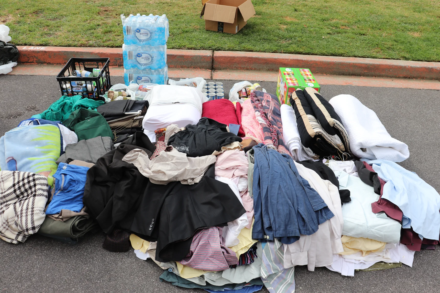 Clothing, blankets, water, and other supplies staged for Carolina Cares outreach in 2020